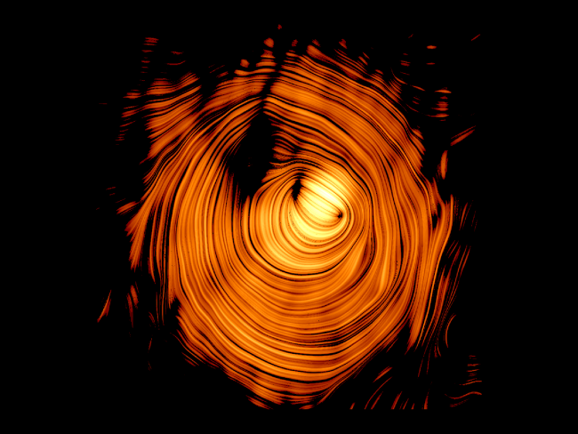 An image of a cosmic jet, which is a ring of concentric bright orange lines, set on a black background.